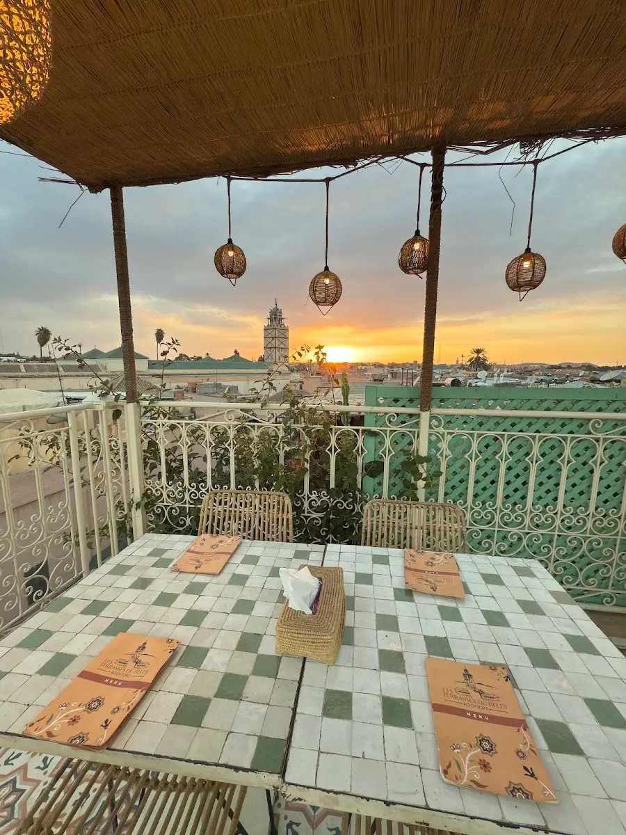 The rooftop terrace at sunset with a view of the Koutoubia minaret